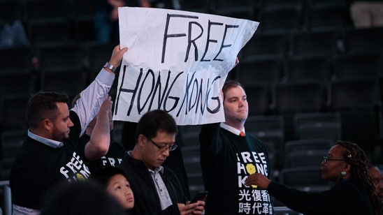 Protesters show support for Hong Kong at Wizards game