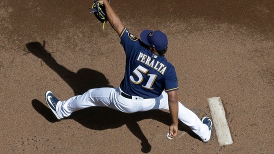 Rookie Peralta helps Brewers blank Reds