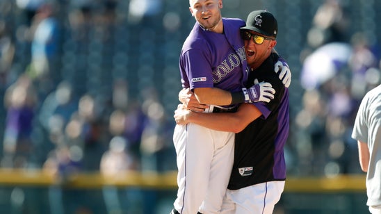 Hampson's single in 10th rallies Rockies past Marlins, 7-6