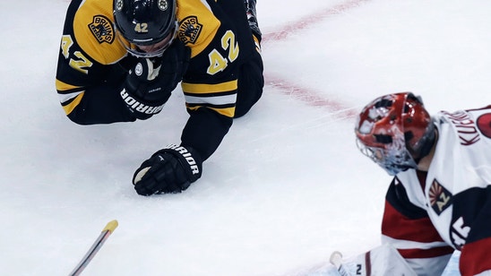 Bruins' David Backes takes skate to face, returns