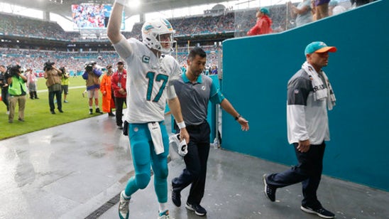 Wearing brace, Dolphins' Tannehill returns to practice field