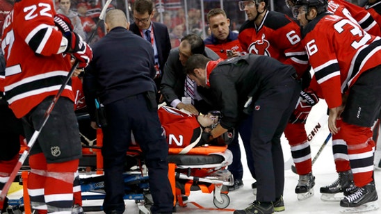 Devils defenseman John Moore removed from ice on stretcher