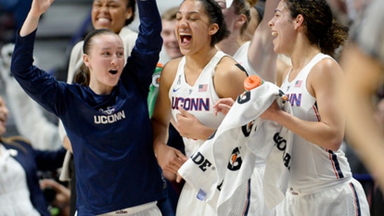 UConn's former walk-on Lawlor shooting for her fourth title