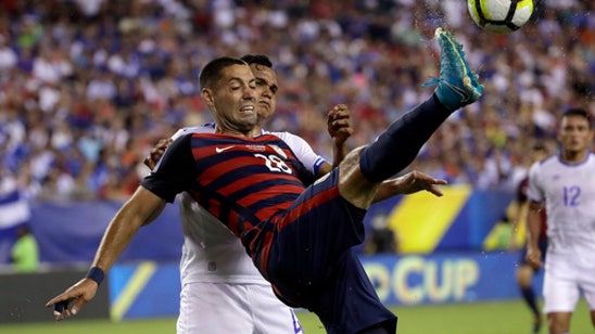 US survives bites, tops El Salvador 2-0 to advance