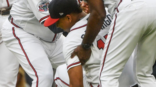 Braves player trips jogging over chalk line, hurts knee