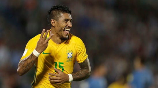 Barca to sign Brazil midfielder Paulinho from Chinese club