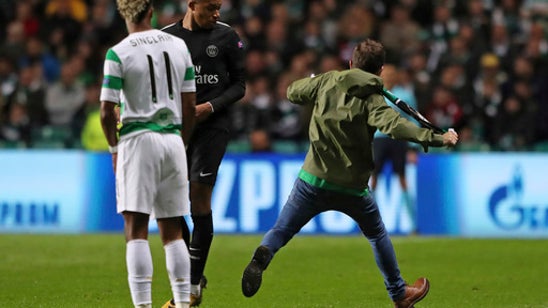 Celtic fan runs on to field in Champions League game