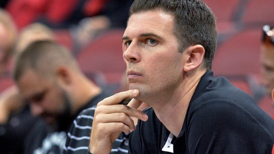 Louisville interim coach Padgett adds Paulus as an assistant