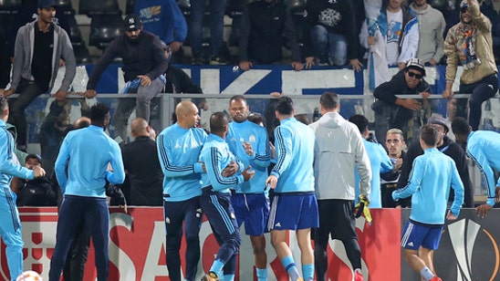 Marseille suspends Evra for kicking fan pending UEFA hearing