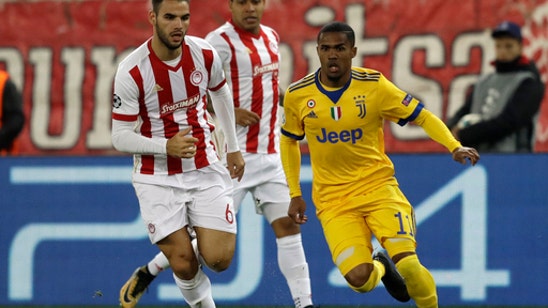 Juventus beats Olympiakos 2-0 to advance in Champions League