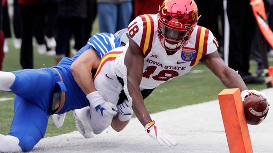 Hornibrook's 4 TDs carry Badgers past Miami, 34-24 in Orange