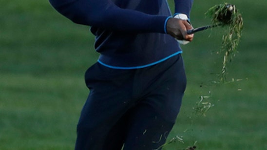 Woods brings back big crowds, big cheers with a 72