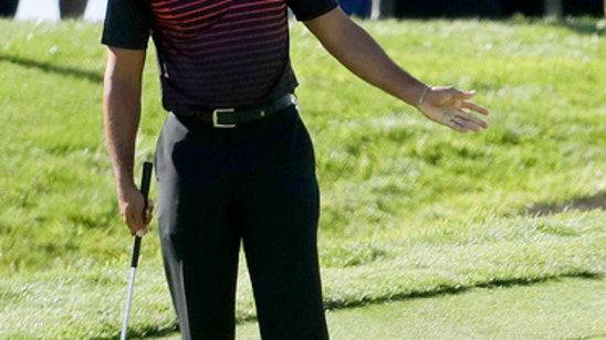 The Latest: Woods finishes opening round at even-par 72