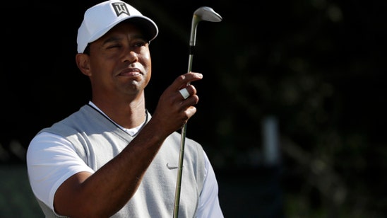 Woods all over Torrey Pines and scratches out a 70