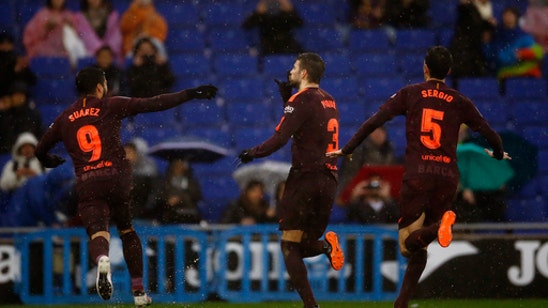 Barcelona avoids 2nd loss to Espanyol with late Pique goal
