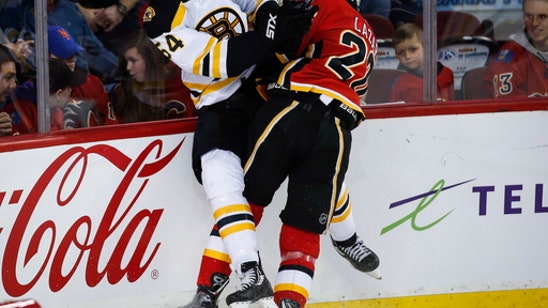 Marchand scores in OT to lift Bruins over Flames 2-1