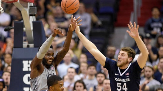 Marshall helps No. 4 Xavier beat Georgetown 89-77