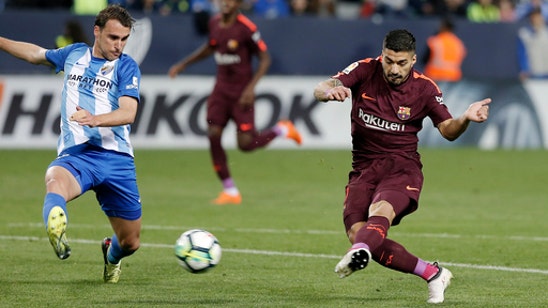 Barcelona beats Malaga while Messi attends birth of son