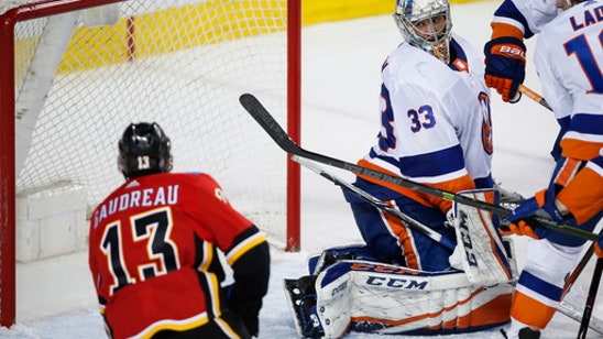 Gibson makes 50 saves, Islanders beat Flames 5-2 to end skid