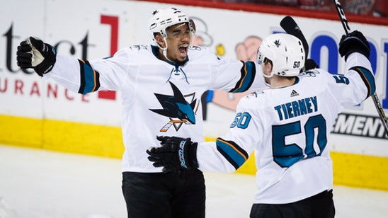 Kane scores 4 goals to lead Sharks past Flames 7-4
