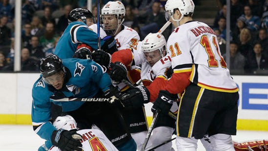 Kane scores twice to lead streaking Sharks past Flames 5-1