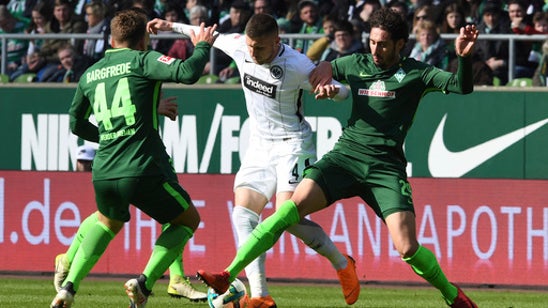 Bremen beats Frankfurt 2-1 to leave relegation fears behind