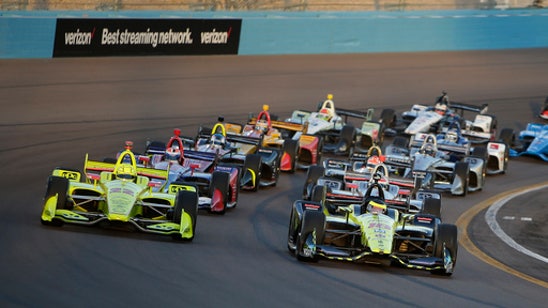 The Latest: Will Power takes IndyCar lead