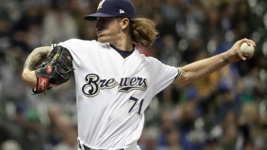 Guerra deals, Thames homers to lift Brewers over Reds 2-0