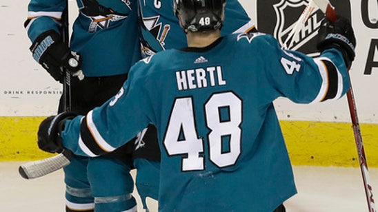 AP source: Couture agrees to 8-year extension with Sharks