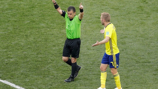 The Latest: FIFA ‘extremely satisfied’ with referee standard