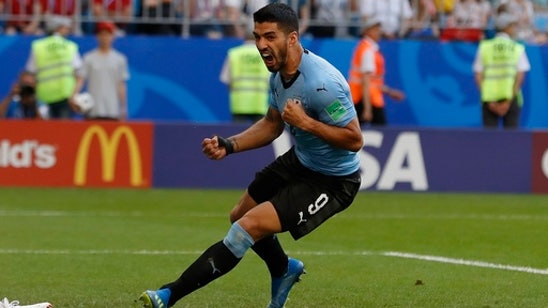 Suarez scores again, Uruguay beats host Russia 3-0