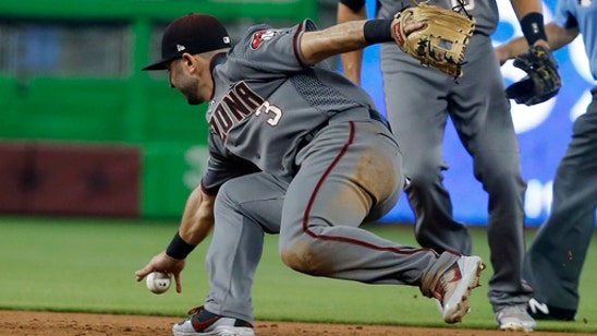 Greinke’s hitting and pitching help D-backs beat Marlins 4-0