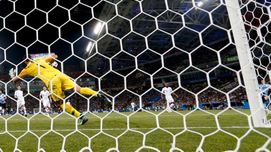 Cavani scores twice, Uruguay ousts Ronaldo and Portugal 2-1
