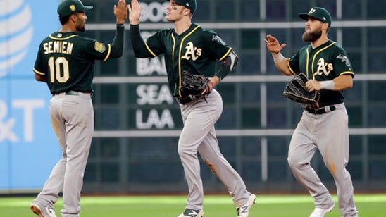 Canha’s two-run single helps A’s rally past Astros 6-4