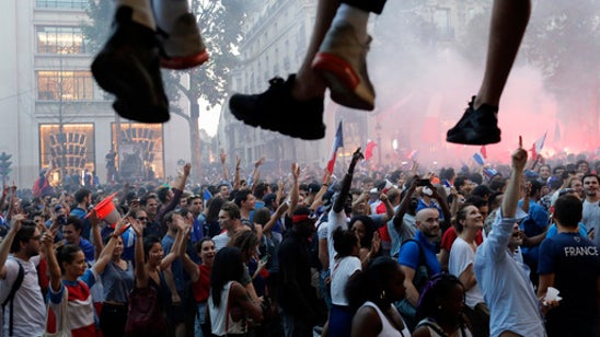 The Latest: French soccer team gets hero’s welcome in Paris