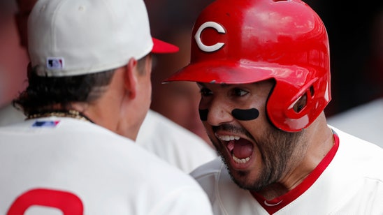 Suarez homers early, Reds hold on for 8-6 win over Cubs