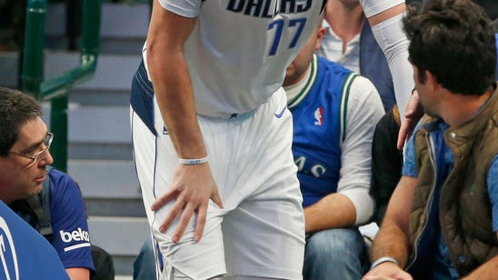 Doncic injures ankle, Mavs rally, fall to Heat 122-118 in OT