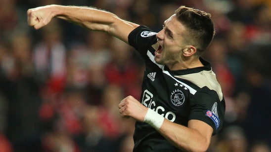 Ajax holds Benfica to 1-1 draw in Champions League