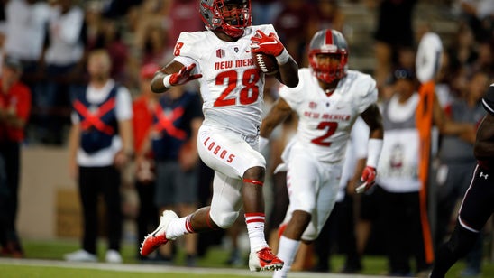 Davis' 4 rushing TDs help New Mexico beat New Mexico State