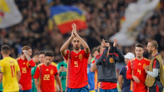 Spain holds on for 2-1 win over Romania in Euro qualifier