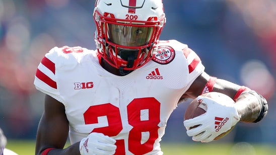 Huskers RB Washington surrenders to California authorities
