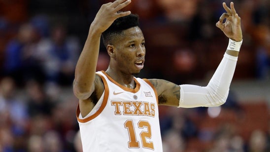 Osetkowski, defense lead Texas past No. 11 Kansas 73-63