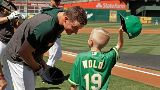 A's sign 8-year-old for a day through Make-A-Wish Foundation