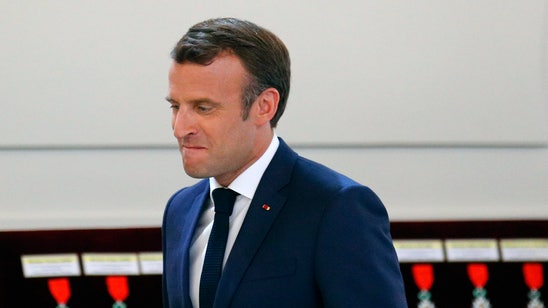 French soccer leader seeks to smooth Macron row