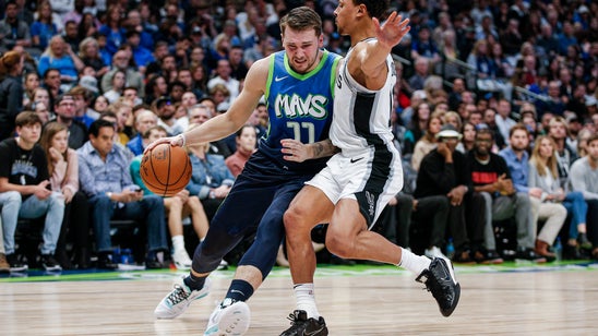 Doncic nets 24 in return from injury, Mavs beat Spurs 102-98