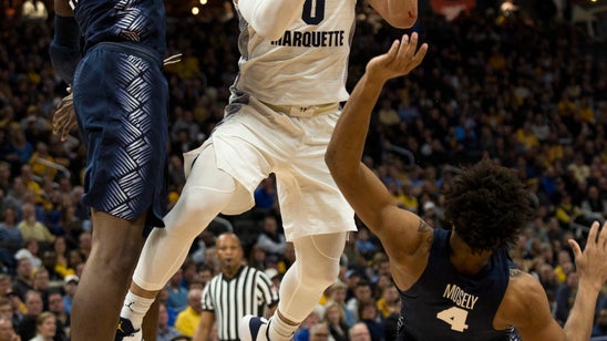 No. 16 Marquette's Howard scoring in bunches