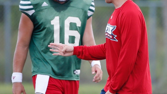 Youth is served: Weis Jr., 25, stands with Kiffin at FAU