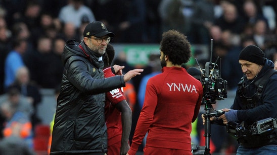 As Liverpool keeps pressure on City, Spurs slip far away