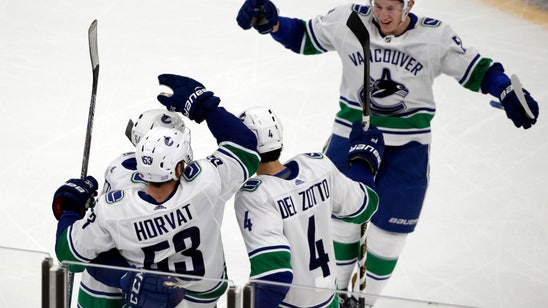 Canucks beat Bruins 8-5 for 5th straight win