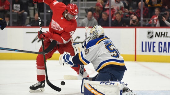 Blues beat Red Wings in OT after blowing lead